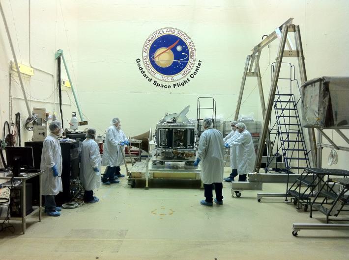 Engineers surrounding the GMI as it arrives at Goddard